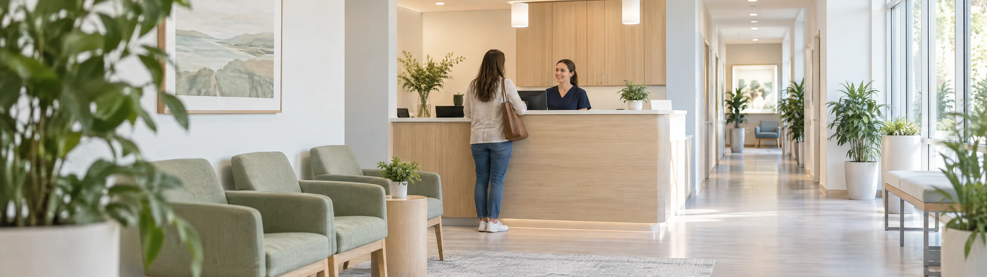 Waiting area and reception counter of a medical clinic, lit by daylight.